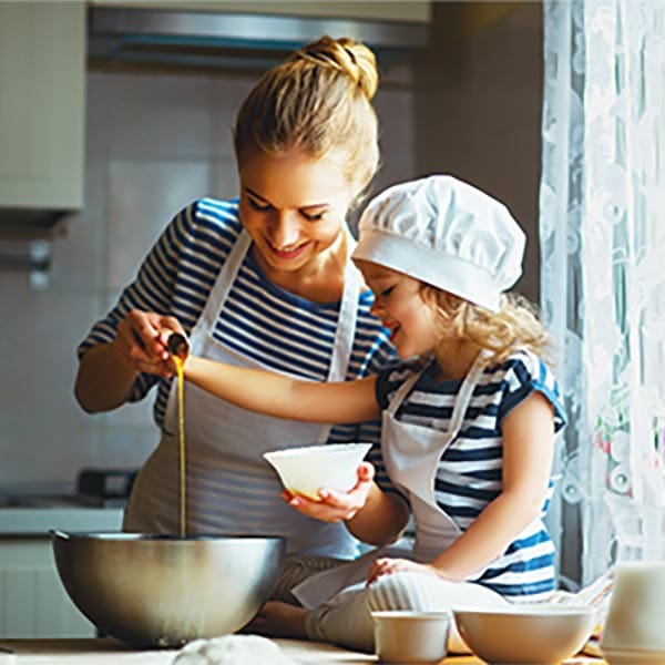 Mom and daughter cooking